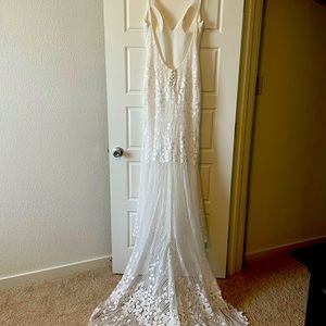 Wedding dress. Brand new and never worn (reception dress, but never used)
